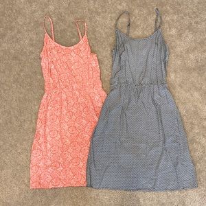 Cute summer dresses both size XS one in a coral/pink color and other in black.